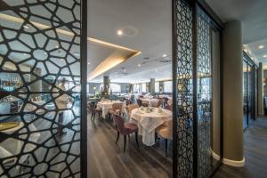 Restoran või mõni muu söögikoht majutusasutuses Hotel Spinale