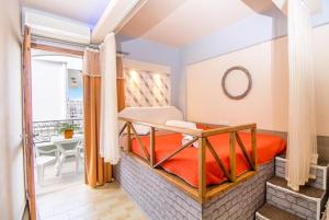 Ένα ή περισσότερα κρεβάτια σε δωμάτιο στο Takis Hotel Apartments