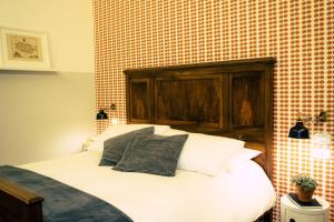 Postel nebo postele na pokoji v ubytování Arsenale Suites