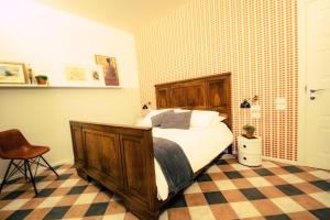 Postel nebo postele na pokoji v ubytování Arsenale Suites