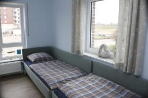 מיטה או מיטות בחדר ב-Strandgut