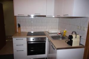 Kuchyňa alebo kuchynka v ubytovaní Ella Apartments