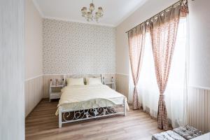 Ліжко або ліжка в номері Lovely apartment in the city center