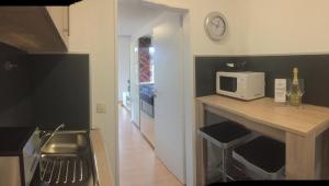 Kuchyň nebo kuchyňský kout v ubytování Comfort-Apartment
