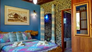 Ένα ή περισσότερα κρεβάτια σε δωμάτιο στο Pousada Casa Fazenda do Rio
