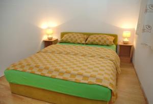 Кровать или кровати в номере Apartments Dino