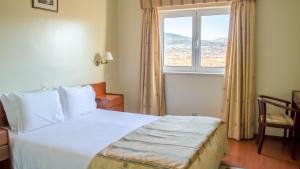 Cama ou camas em um quarto em Hotel Belsol