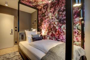 Ένα ή περισσότερα κρεβάτια σε δωμάτιο στο Vienna House Easy by Wyndham Hamburg City