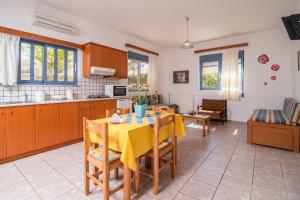 A kitchen or kitchenette at Roula Apartments