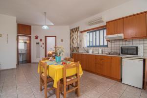 A kitchen or kitchenette at Roula Apartments