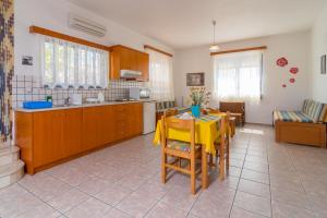 A kitchen or kitchenette at Roula Apartments
