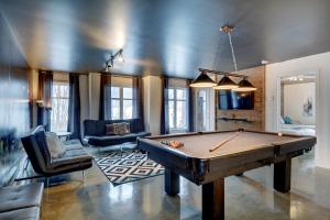 a living room with a pool table in it at Le Vallon in Saint-Férréol-les-Neiges