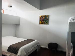 Letto o letti in una camera di Hostal Posada del Maple