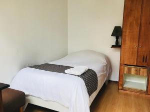 Letto o letti in una camera di Hostal Posada del Maple