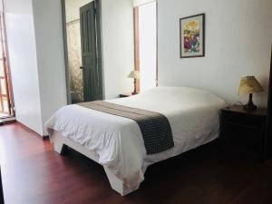 Letto o letti in una camera di Hostal Posada del Maple