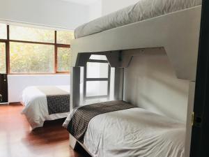 Letto o letti in una camera di Hostal Posada del Maple