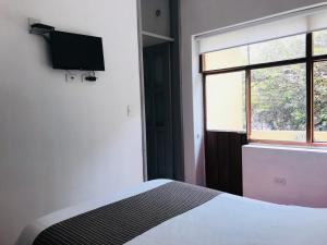 Letto o letti in una camera di Hostal Posada del Maple