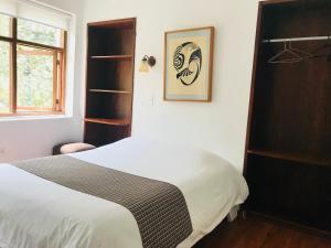 Letto o letti in una camera di Hostal Posada del Maple