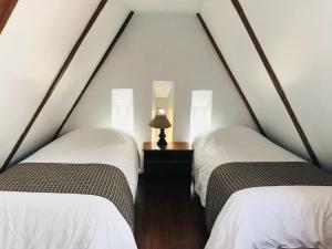 Letto o letti in una camera di Hostal Posada del Maple