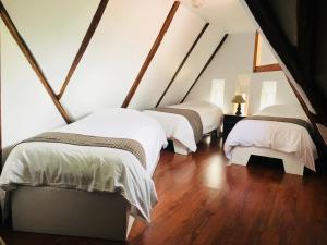 Letto o letti in una camera di Hostal Posada del Maple