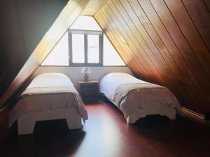 Letto o letti in una camera di Hostal Posada del Maple