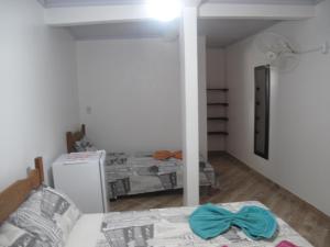 Postel nebo postele na pokoji v ubytování Suítes Cantinho da Pedra
