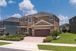 a large house with a garage at Disney Dreams Luxury Home with Private Water Park in Orlando