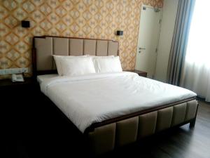 Postel nebo postele na pokoji v ubytování Wifi Boutique Hotel