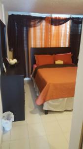 Postel nebo postele na pokoji v ubytování Luquillo Beach Getaway