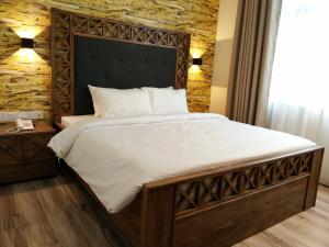 Postel nebo postele na pokoji v ubytování Wifi Boutique Hotel