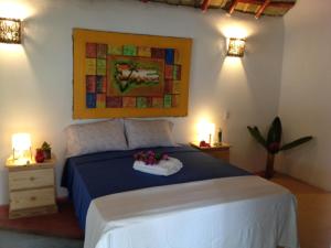Säng eller sängar i ett rum på Villa La Caleta