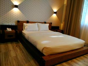 Postel nebo postele na pokoji v ubytování Wifi Boutique Hotel