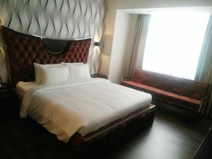 Postel nebo postele na pokoji v ubytování Wifi Boutique Hotel