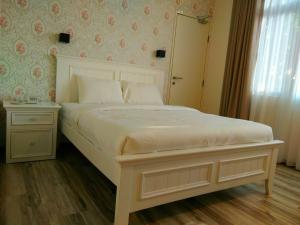 Postel nebo postele na pokoji v ubytování Wifi Boutique Hotel