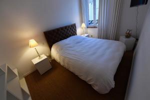 מיטה או מיטות בחדר ב-Appartement Week-end