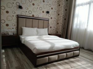 Postel nebo postele na pokoji v ubytování Wifi Boutique Hotel