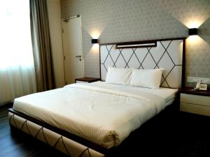 Postel nebo postele na pokoji v ubytování Wifi Boutique Hotel