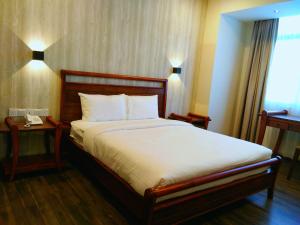 Postel nebo postele na pokoji v ubytování Wifi Boutique Hotel