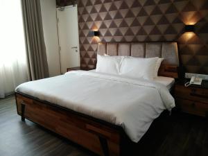 Postel nebo postele na pokoji v ubytování Wifi Boutique Hotel