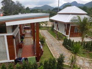 an aerial view of a house with a porch at Slow Life Sabaidee Pai in Pai