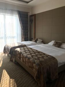 Кровать или кровати в номере YZE Pırlanta Hotel