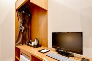 TV a/nebo společenská místnost v ubytování Blanc Business Hotel