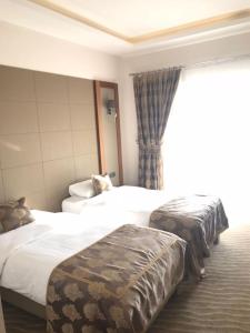 Кровать или кровати в номере YZE Pırlanta Hotel