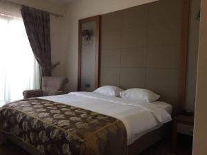 Кровать или кровати в номере YZE Pırlanta Hotel