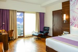 Postel nebo postele na pokoji v ubytování Purple Palms Resort & Spa