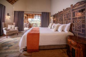 Ліжко або ліжка в номері La Kruger Lifestyle Lodge - No Loadshedding