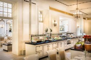 a large kitchen with dishes of food on a counter at Villa Abbazia - by Liburnia Hotels & Villas in Opatija