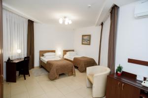 Postel nebo postele na pokoji v ubytování M&M Aparthotel + 9 fotografií