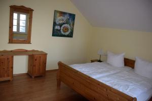 Postel nebo postele na pokoji v ubytování Schweizer Haus Wippra