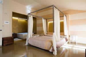 Postel nebo postele na pokoji v ubytování Alessi Hotel Trattoria